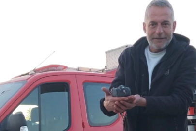 Bursa'da asılı kalan güvercini halatla inip kurtardılar