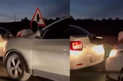 Bursa'da halat bulamayınca canını hiçe saydı: Aracı kaputa çıkıp itti